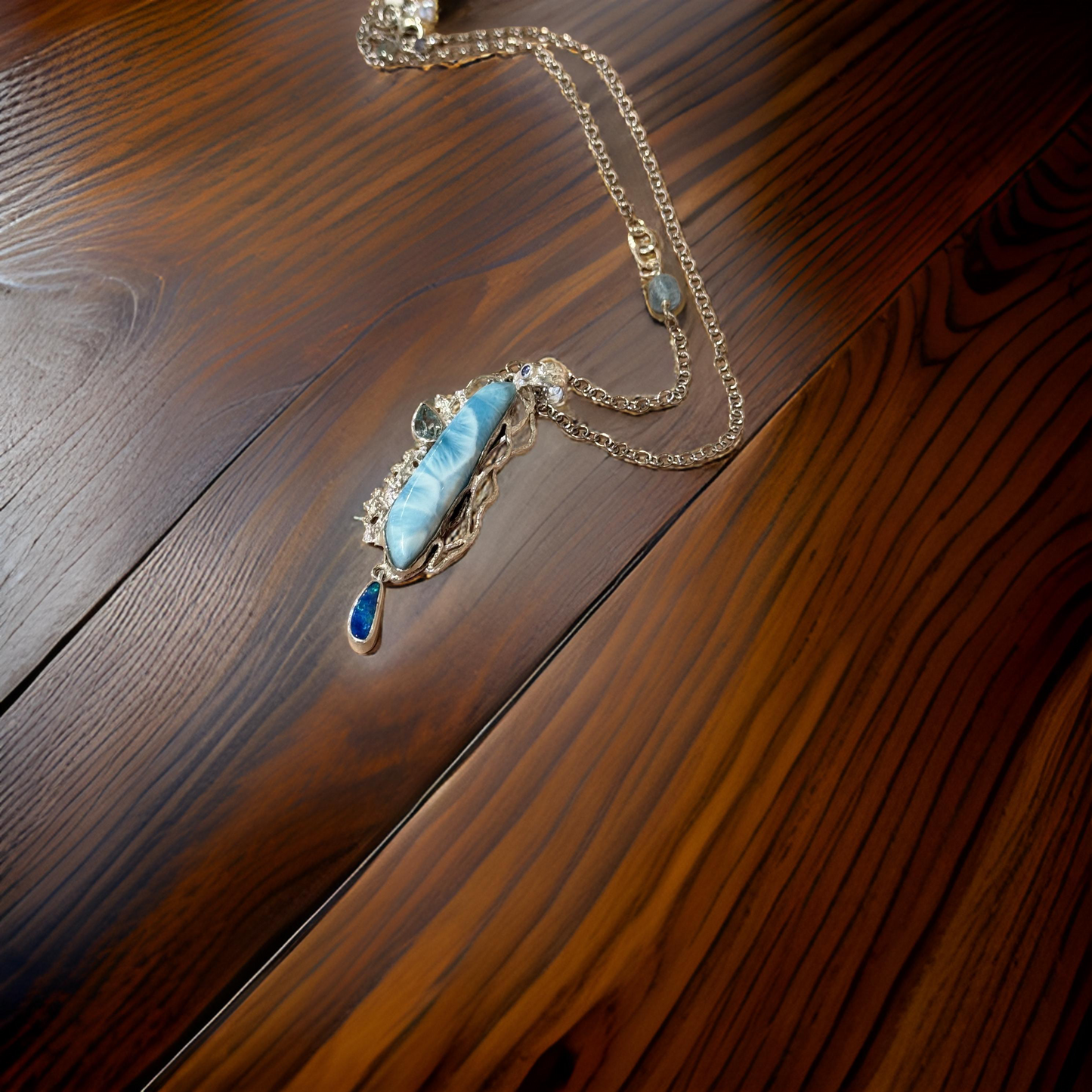 Ocean’s Elegance – Larimar, Tanzanite, Opal & Blue Topaz Statement Necklace